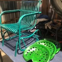 Green metal patio chair beside lime green tractor seats