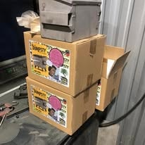 Stacked customer job boxes in the garage